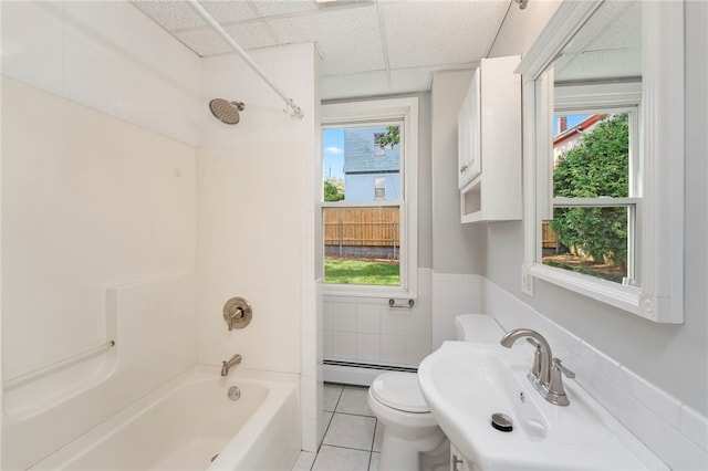 65 Lancaster St Unit 1, Providence, RI 02906 - bathroom featuring shower / bathtub combination, a paneled ceiling, plenty of natural light, tile patterned flooring, and tile walls