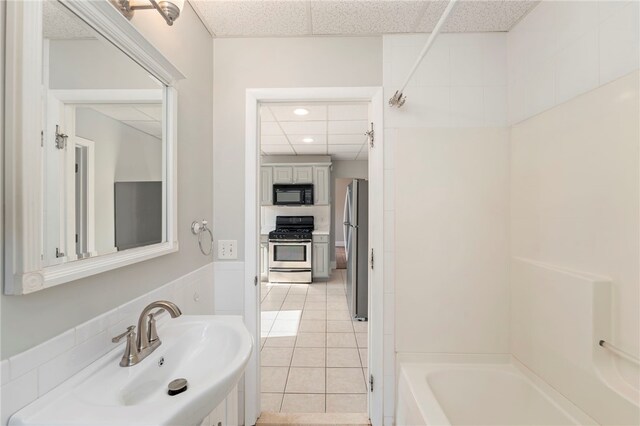 65 Lancaster St Unit 1, Providence, RI 02906 - full bath with washtub / shower combination, a paneled ceiling, tile patterned flooring, recessed lighting, and vanity