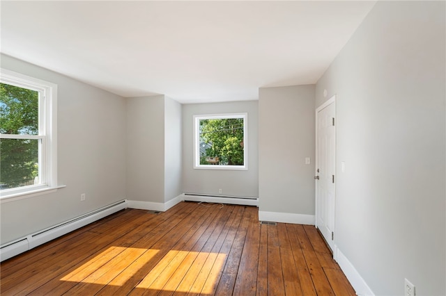 65 Lancaster St Unit 1, Providence, RI 02906 - empty room with baseboard heating and wood-type flooring