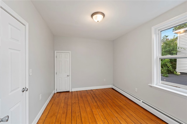 65 Lancaster St Unit 1, Providence, RI 02906 - spare room with a baseboard radiator and light wood-style floors