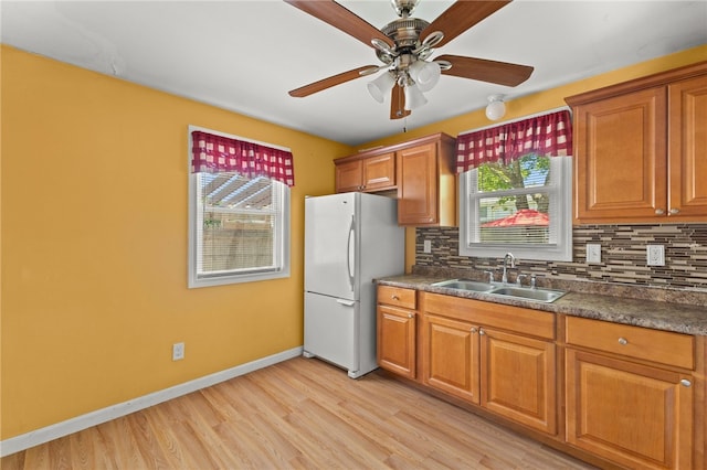 21 Cypress Ave, Tiverton, RI 02878 - kitchen featuring freestanding refrigerator, a ceiling fan, and brown cabinets