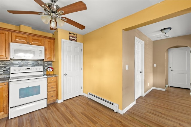 21 Cypress Ave, Tiverton, RI 02878 - kitchen featuring white appliances, a baseboard radiator, arched walkways, light wood-style flooring, and tasteful backsplash