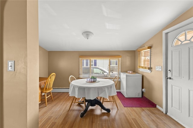 21 Cypress Ave, Tiverton, RI 02878 - dining space featuring wood finished floors and a baseboard heating unit