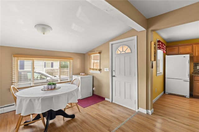 21 Cypress Ave, Tiverton, RI 02878 - dining space with lofted ceiling, light wood-style flooring, and baseboard heating