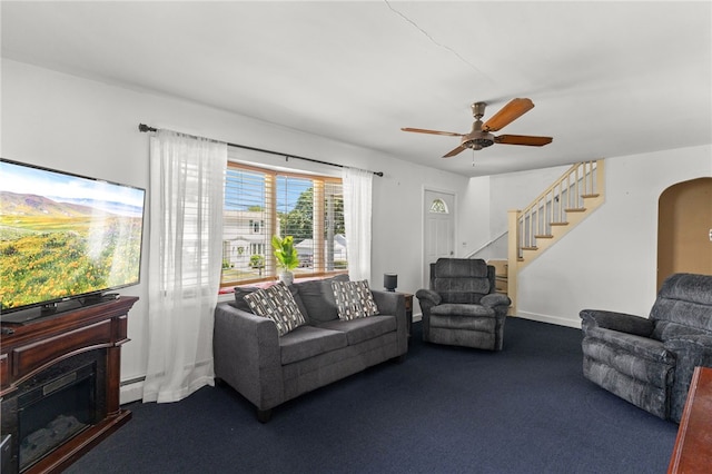 21 Cypress Ave, Tiverton, RI 02878 - living room with carpet, a ceiling fan, stairway, arched walkways, and a fireplace