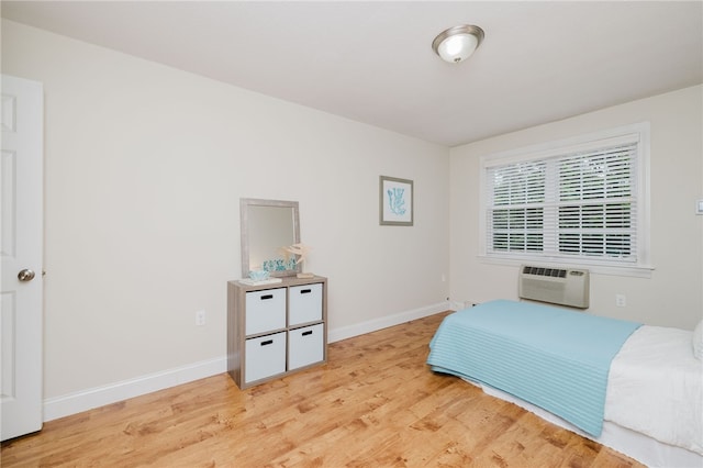 25 Bullocks Poing Ave Unit 3A, East Providence, RI 02915 - bedroom with light wood-style flooring and a wall unit AC