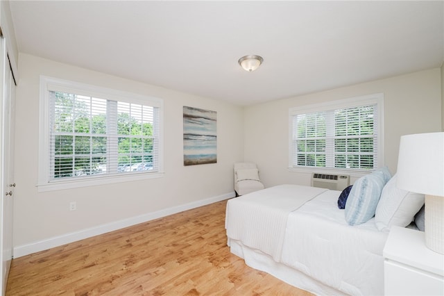 25 Bullocks Poing Ave Unit 3A, East Providence, RI 02915 - bedroom with light wood-style floors and a wall mounted AC