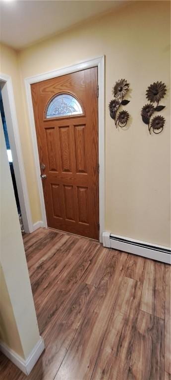 26 Morton Ave, Johnston, RI 02919 - entrance foyer featuring a baseboard radiator and wood finished floors