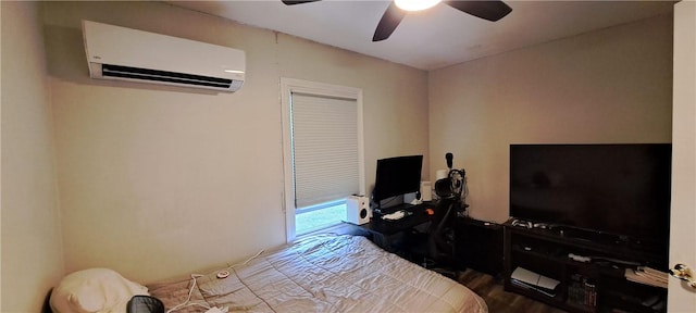 26 Morton Ave, Johnston, RI 02919 - bedroom with an AC wall unit, a desk, wood finished floors, and a ceiling fan