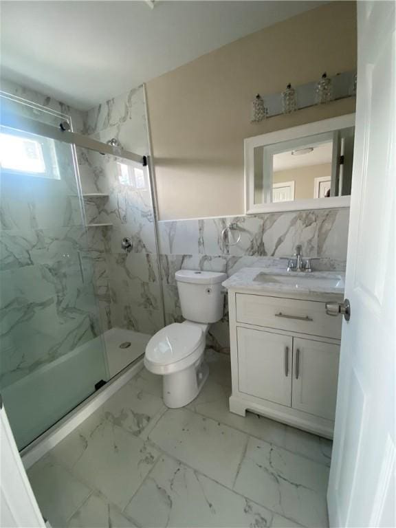 4 Halton St, Providence, RI 02907 - bathroom with tile walls, marble finish floors, vanity, a marble finish shower, and a wainscoted wall