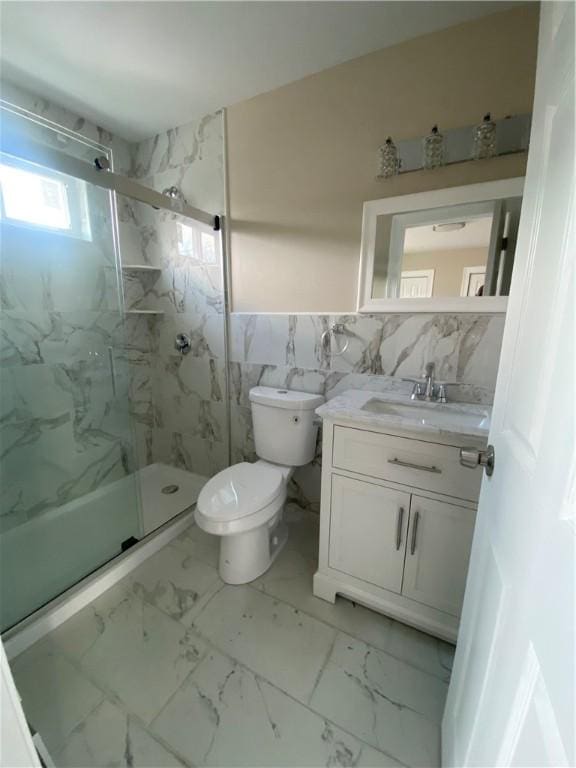 4 Halton St, Providence, RI 02907 - bathroom with marble finish floors, tile walls, vanity, and a marble finish shower