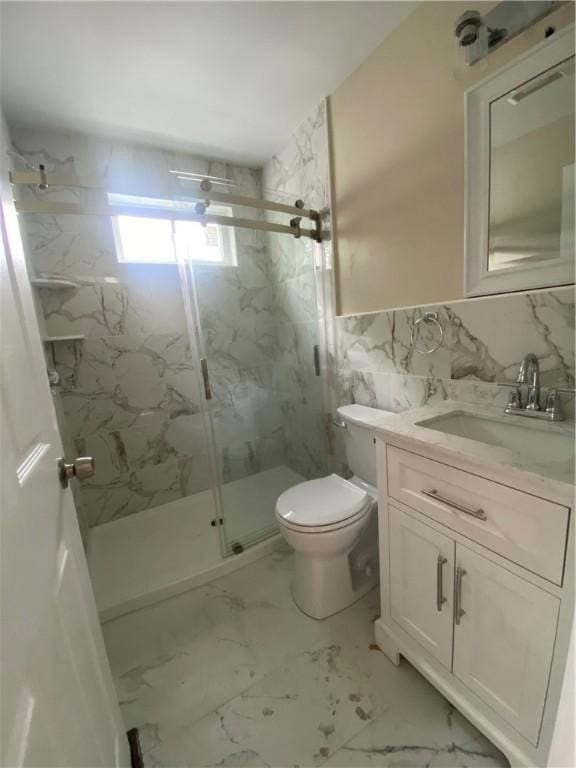 4 Halton St, Providence, RI 02907 - full bathroom featuring a marble finish shower, vanity, marble look tiles, and tile walls