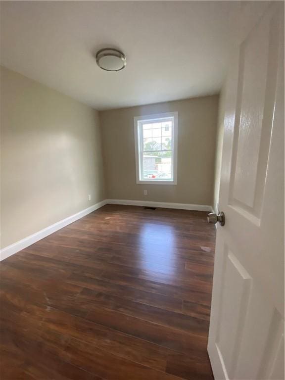 4 Halton St, Providence, RI 02907 - empty room with dark wood-style flooring