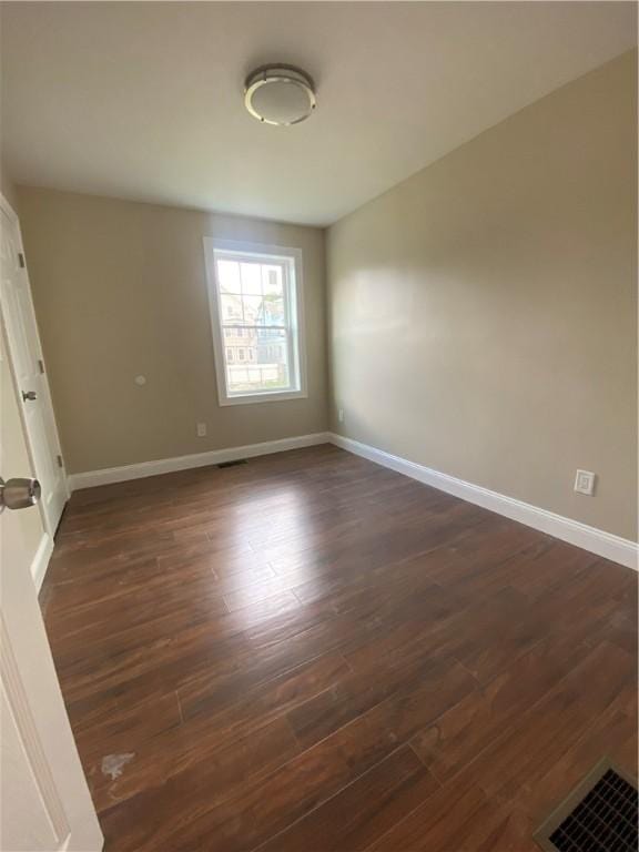 4 Halton St, Providence, RI 02907 - spare room with dark wood-type flooring and baseboards