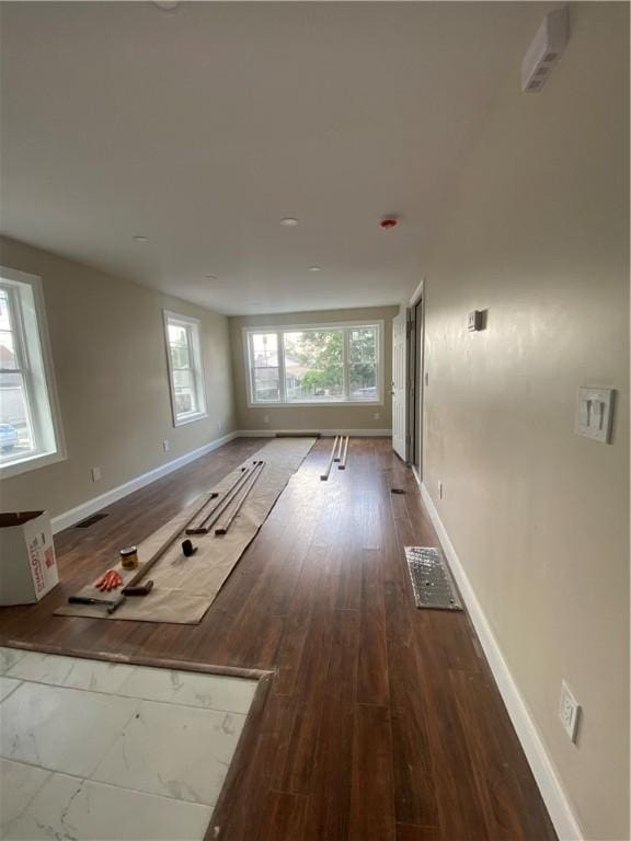 4 Halton St, Providence, RI 02907 - unfurnished living room with baseboards and wood finished floors