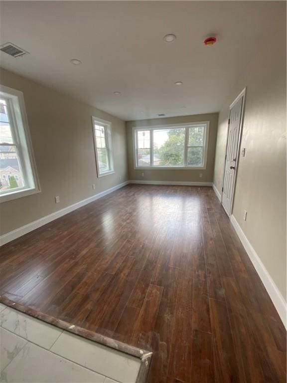 4 Halton St, Providence, RI 02907 - unfurnished room with dark wood-style flooring and baseboards