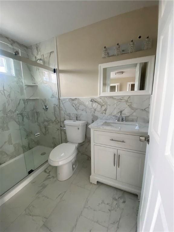 4 Halton St, Providence, RI 02907 - full bath featuring vanity, tile walls, a marble finish shower, and marble finish floors