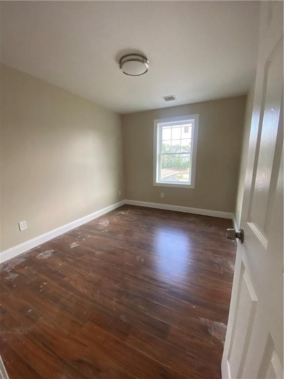 4 Halton St, Providence, RI 02907 - spare room with dark wood-style floors and baseboards