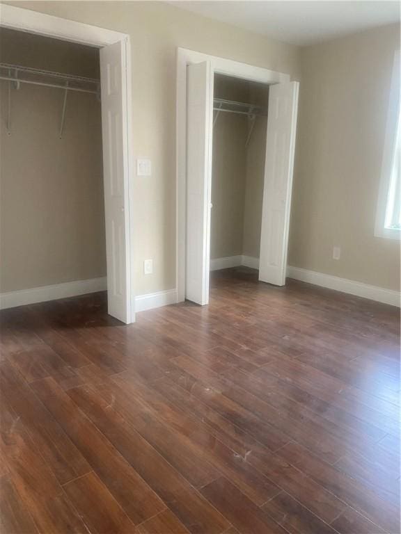 4 Halton St, Providence, RI 02907 - unfurnished bedroom with dark wood-style floors and a closet