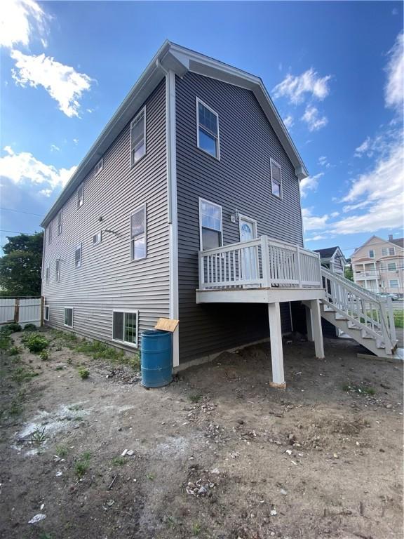 4 Halton St, Providence, RI 02907 - back of house with a wooden deck and stairs
