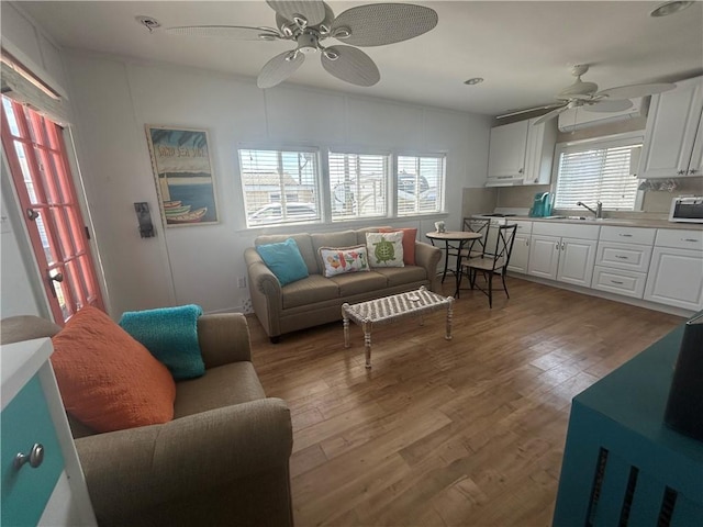 854 Matunuck Beach Rd, South Kingstown, RI 02879 - living area with ceiling fan and light wood-style floors
