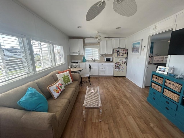 854 Matunuck Beach Rd, South Kingstown, RI 02879 - living area with wood finished floors and ceiling fan