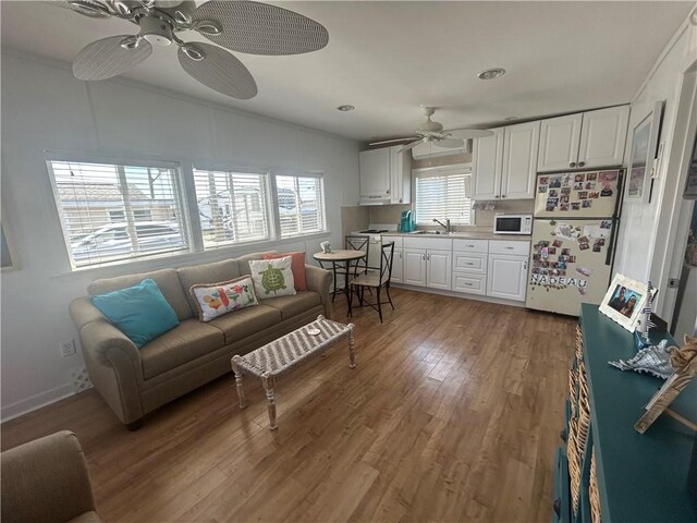 854 Matunuck Beach Rd, South Kingstown, RI 02879 - living area featuring ceiling fan and wood finished floors
