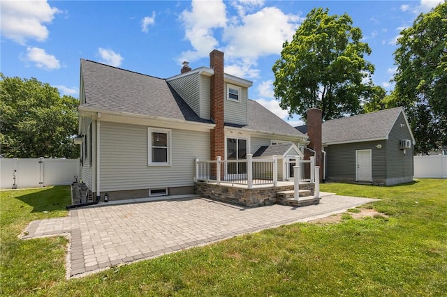 58 E St, West Warwick, RI 02893 - rear view of property with a patio area, a gate, an outbuilding, roof with shingles, and a wooden deck