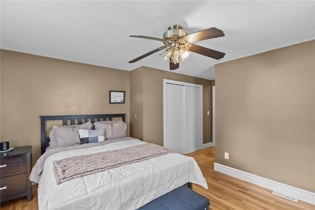 58 E St, West Warwick, RI 02893 - bedroom featuring light wood-type flooring, a closet, and ceiling fan