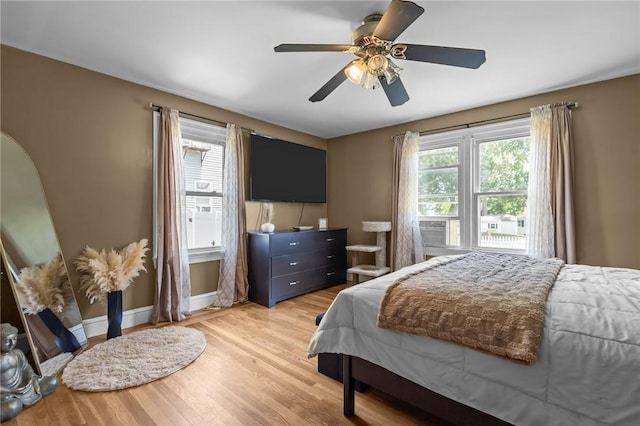 58 E St, West Warwick, RI 02893 - bedroom with light wood finished floors and a ceiling fan