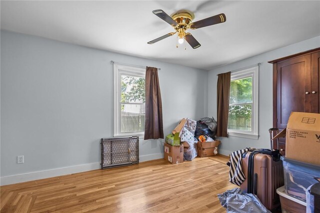 58 E St, West Warwick, RI 02893 - bedroom featuring multiple windows, wood finished floors, and a ceiling fan