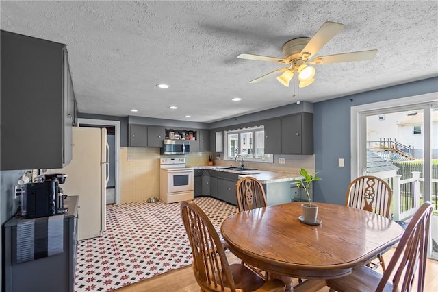 58 E St, West Warwick, RI 02893 - dining area with a textured ceiling, ceiling fan, recessed lighting, and light wood-style floors