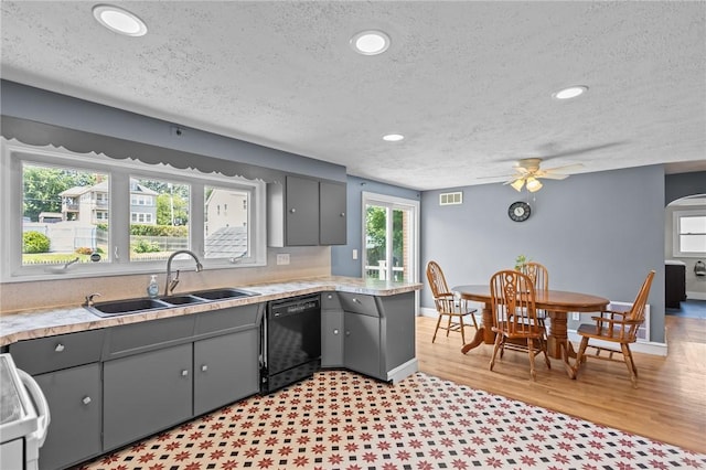 58 E St, West Warwick, RI 02893 - kitchen featuring dishwasher, gray cabinets, a textured ceiling, range, and light countertops