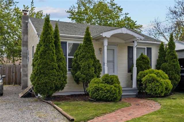 36 Dundas Ave, Warwick, RI 02889 - view of front of home with a chimney and roof with shingles