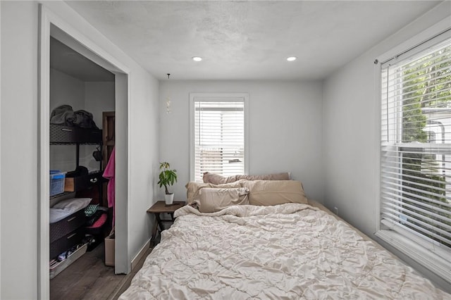 36 Dundas Ave, Warwick, RI 02889 - bedroom featuring wood finished floors, multiple windows, recessed lighting, a spacious closet, and a closet