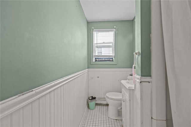 36 Dundas Ave, Warwick, RI 02889 - bathroom featuring a wainscoted wall, tile patterned flooring, a baseboard heating unit, and vanity