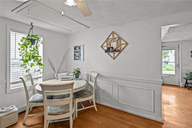 36 Dundas Ave, Warwick, RI 02889 - dining area featuring attic access, a ceiling fan, wood finished floors, and a baseboard heating unit