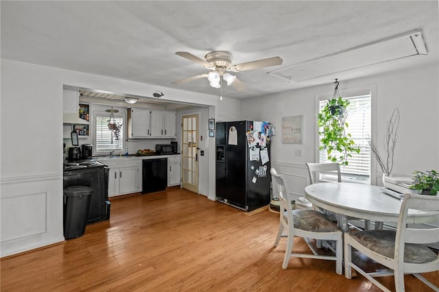 36 Dundas Ave, Warwick, RI 02889 - kitchen with black appliances, healthy amount of natural light, a ceiling fan, and extractor fan