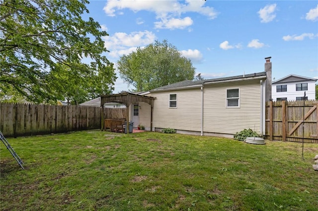 36 Dundas Ave, Warwick, RI 02889 - rear view of house with a fenced backyard
