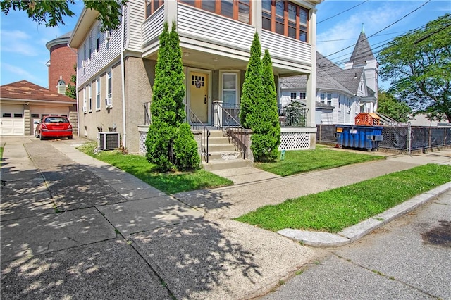 11 Branch Ave, Cranston, RI 02910 - view of front of home with an outdoor structure, a garage, and stucco siding