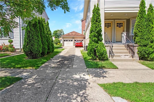 11 Branch Ave, Cranston, RI 02910 - view of front of house with a garage and an outbuilding