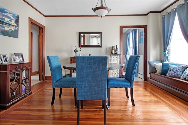 11 Branch Ave, Cranston, RI 02910 - dining area featuring wood-type flooring, ornamental molding, and baseboard heating