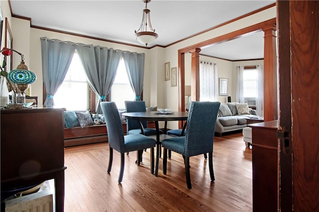 11 Branch Ave, Cranston, RI 02910 - dining room with ornamental molding, ornate columns, wood finished floors, and a baseboard radiator