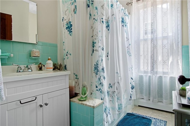 11 Branch Ave, Cranston, RI 02910 - bathroom featuring plenty of natural light, vanity, a shower with curtain, tile walls, and tile patterned flooring