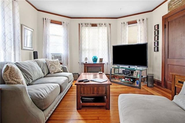 11 Branch Ave, Cranston, RI 02910 - living area featuring crown molding, wood finished floors, cooling unit, and baseboard heating