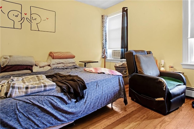 11 Branch Ave, Cranston, RI 02910 - bedroom featuring wood finished floors, cooling unit, and multiple windows