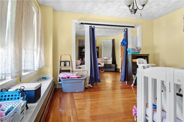 11 Branch Ave, Cranston, RI 02910 - hall with wood finished floors and a chandelier