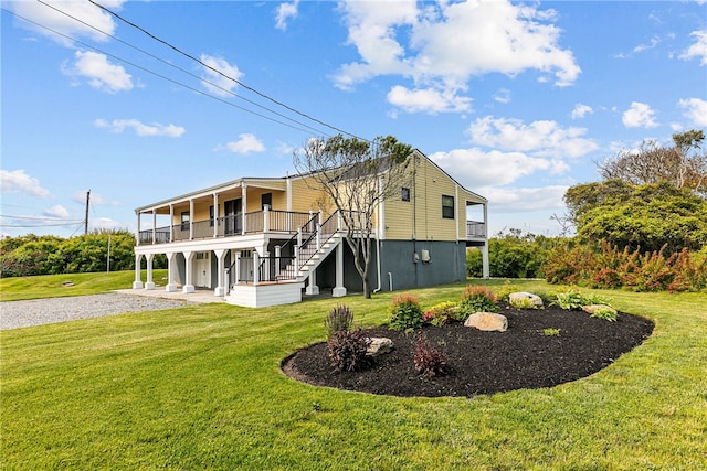212 Round Pond Rd, Little Compton, RI 02837 - back of house featuring gravel driveway, a yard, and stairway