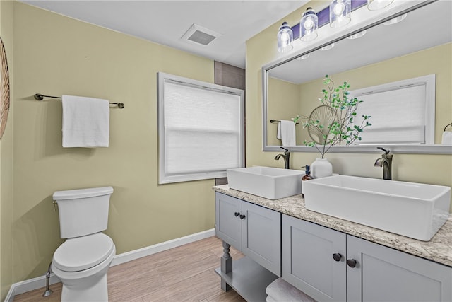 212 Round Pond Rd, Little Compton, RI 02837 - full bathroom featuring double vanity and wood finished floors