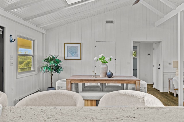 212 Round Pond Rd, Little Compton, RI 02837 - dining space with a baseboard heating unit, wood finished floors, beamed ceiling, wood walls, and high vaulted ceiling